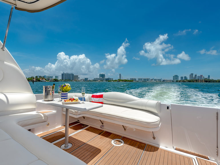 A private yacht charter for a special occasion cruises along the Miami skyline.
