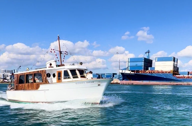 Classic Mizner's Dream Yacht cruises past Port Miami during a skyline cruise of the city.