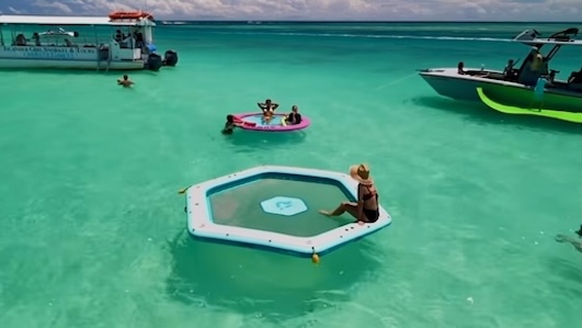 People floating and swimming at the Sandbar in Miami at Haulover.